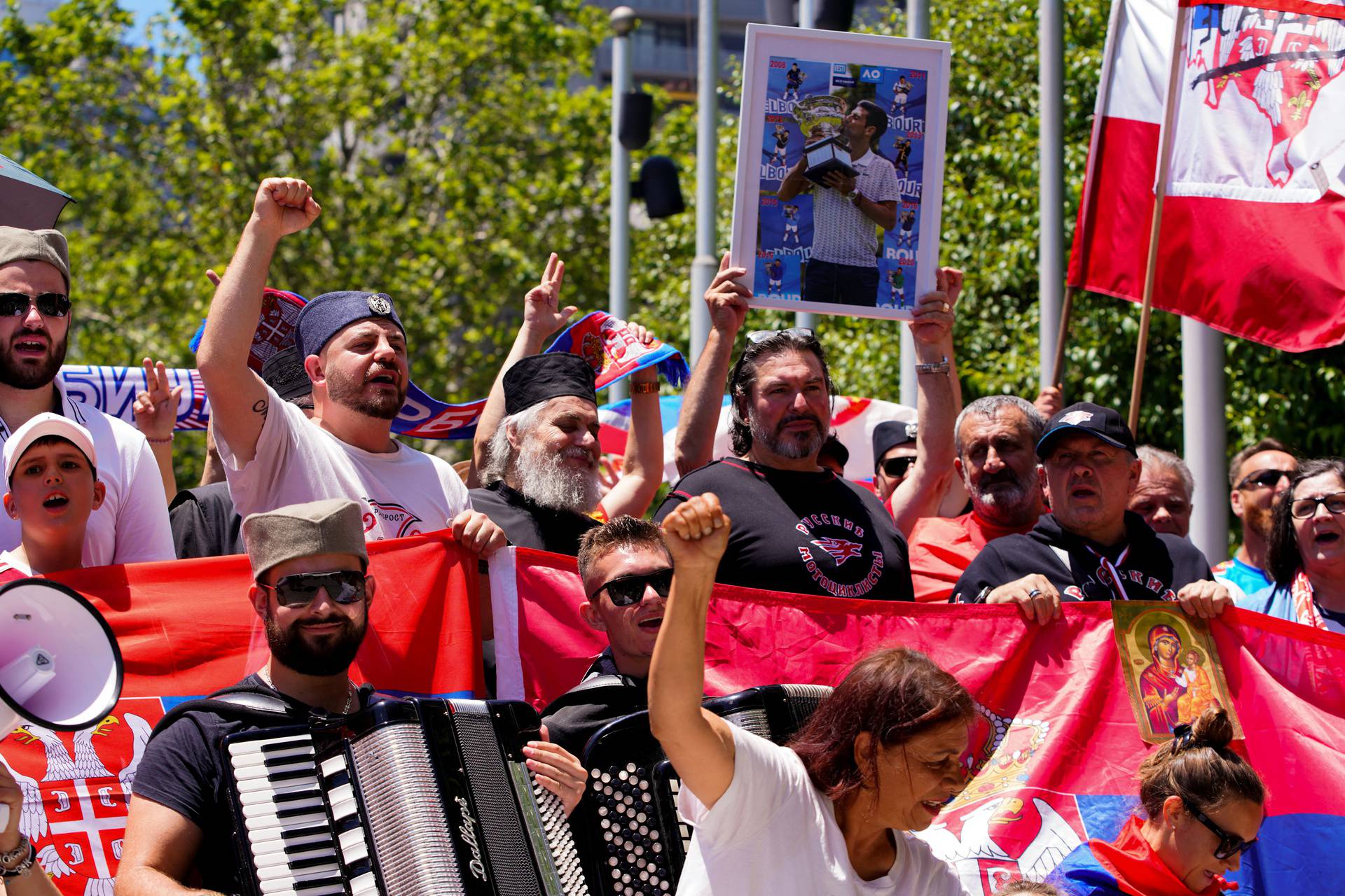 Supporters of Serbian tennis player Novak Djokovic rally outside the Federal Court of Australia