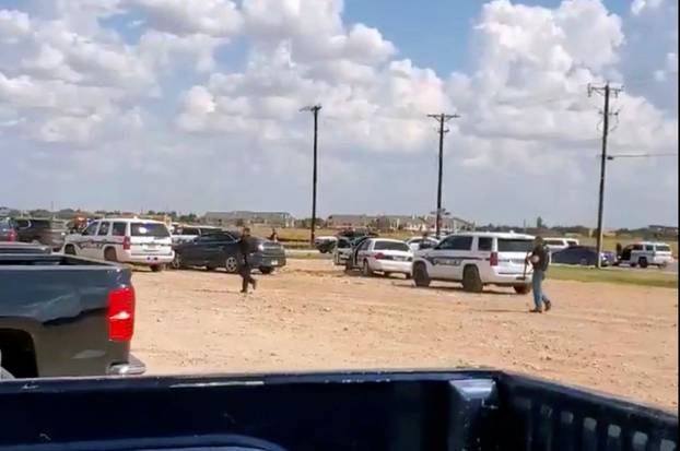 People are evacuated from Cinergy Odessa cinema following a shooting in Odessa, Texas