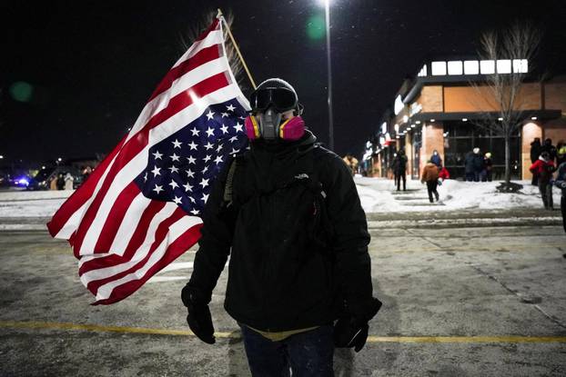 Protest outside the hotel where Bovino, who has been removed from his role, is reportedly staying, in Maple Grove