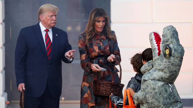 U.S. President Trump and first lady hand out candy to schoolchildren in advance of Halloween in Washington