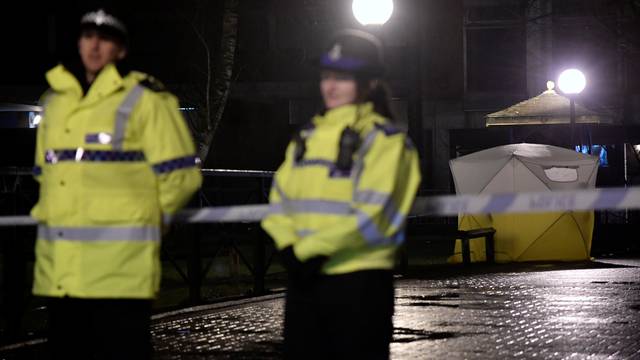Police officers stand guard beside a cordoned-off area, after former Russian military intelligence officer Sergei Skripal, who was convicted in 2006 of spying for Britain, became critically ill after exposure to an unidentified substance, in Salisbury