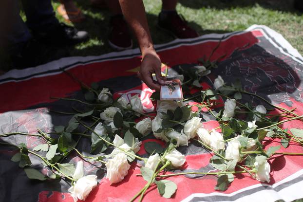Fans of Brazilian football club Flamengo lay flowers at the club