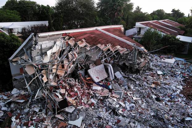 An aerial view shows damage caused following a mass infiltration by Hamas gunmen from the Gaza Strip, in Kibbutz Beeri in southern Israel