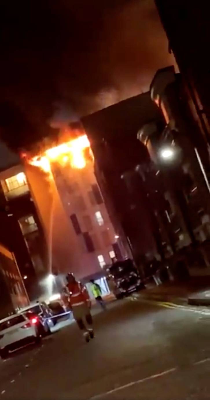 A student accommodation building on fire is pictured in Bolton