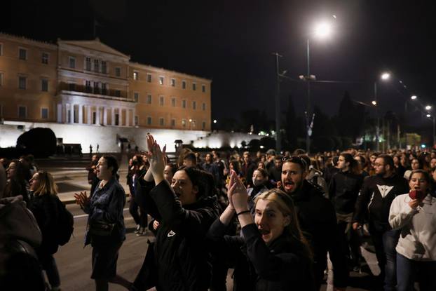 Protesters take part in a demonstration after a train crash near the city of Larissa, in Athens