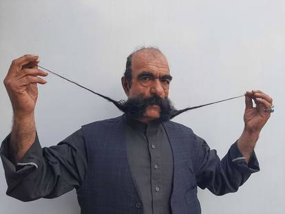 Moustache makes Afghan tailor a celebrity