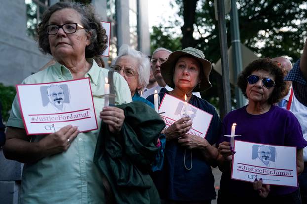 FILE PHOTO: The Committee to Protect Journalists and other press freedom activists hold a candlelight vigil in front of the Saudi Embassy in Washington D.C. to mark the anniversary of the killing of journalist Jamal Khashoggi