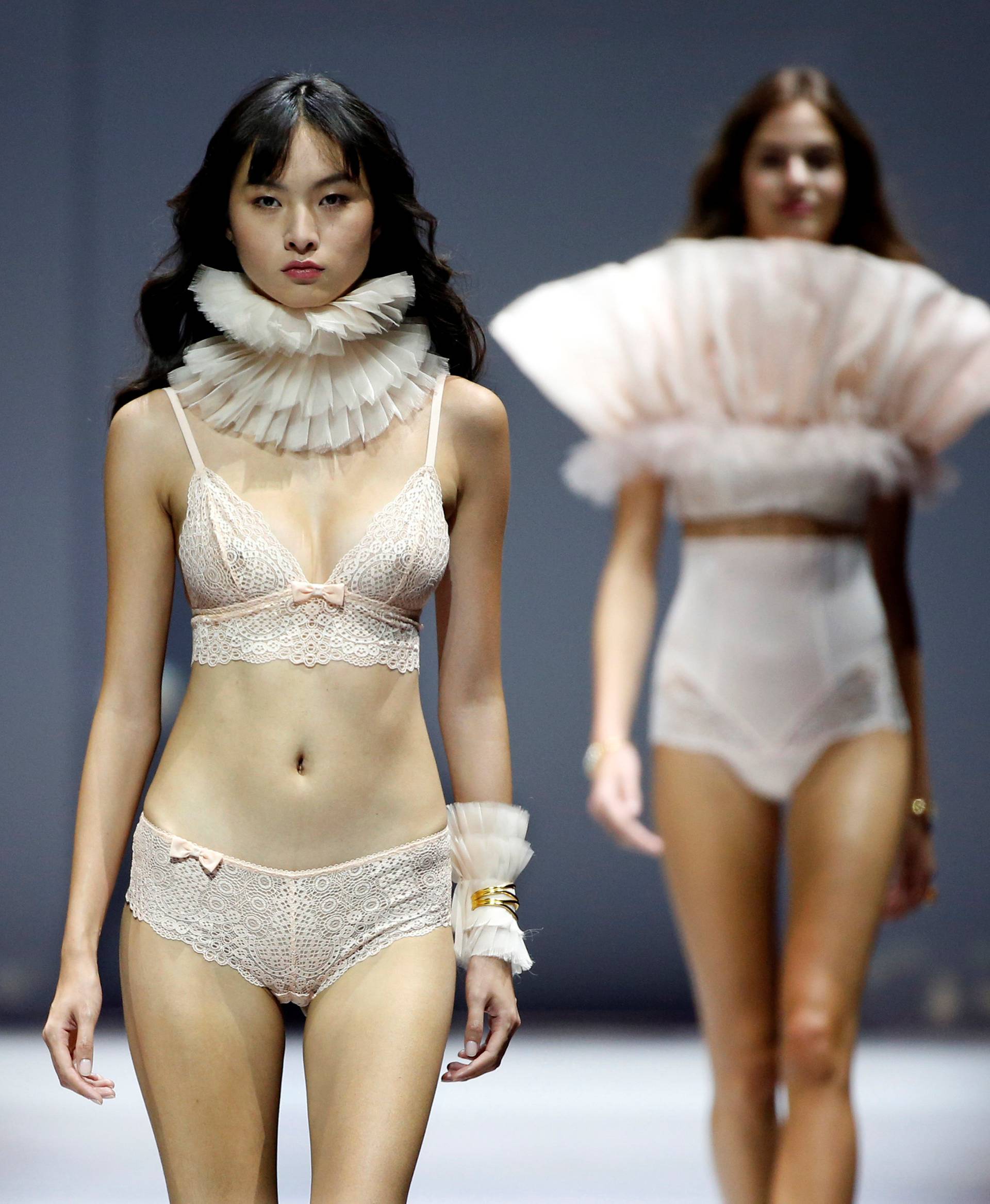 Models present creations during the Etam Live Show Lingerie at the Fashion Week in Paris