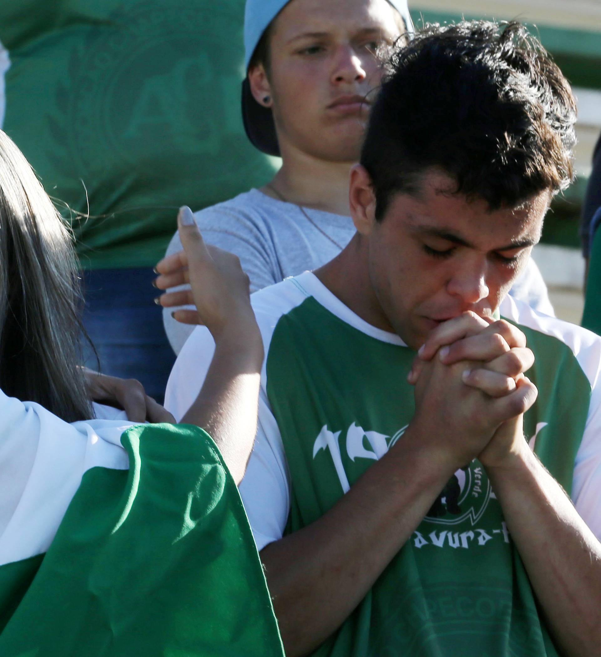 Fans of Chapecoense soccer team react at the Arena Conda stadium in Chapeco