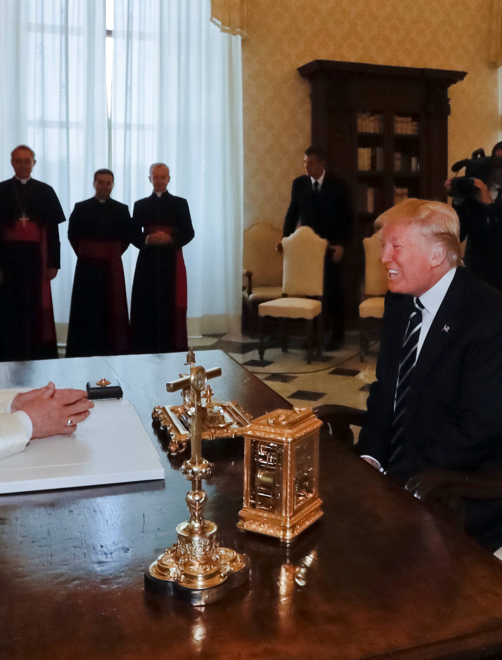 Pope Francis meets U.S. President Donald Trump during a private audience at the Vatican