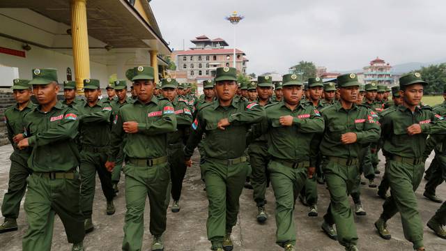 FILE PHOTO: United Wa State Army ( UWSA ) soldier march as they display for media in Pansang, Wa territory in north east Myanma