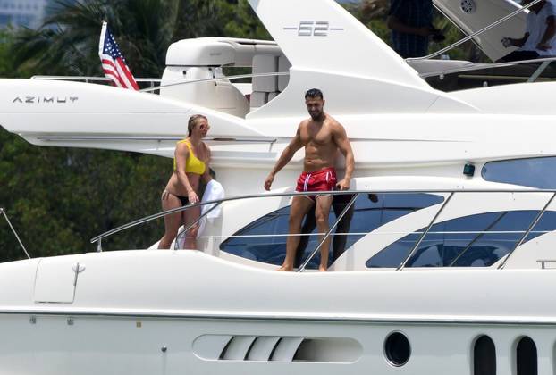 *NO WEB UNTIL 1900 BST 10TH JUNE PREMIUM EXCLUSIVE* Britney Spears wears a yellow bikini as she has an action-packed afternoon on a yacht with boyfriend Sam Asghari in Miami
