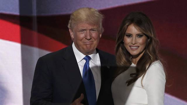 Republican U.S. presidential candidate Donald Trump gives a thumbs up with his wife Melania after she concluded her remarks at the Republican National Convention in Cleveland