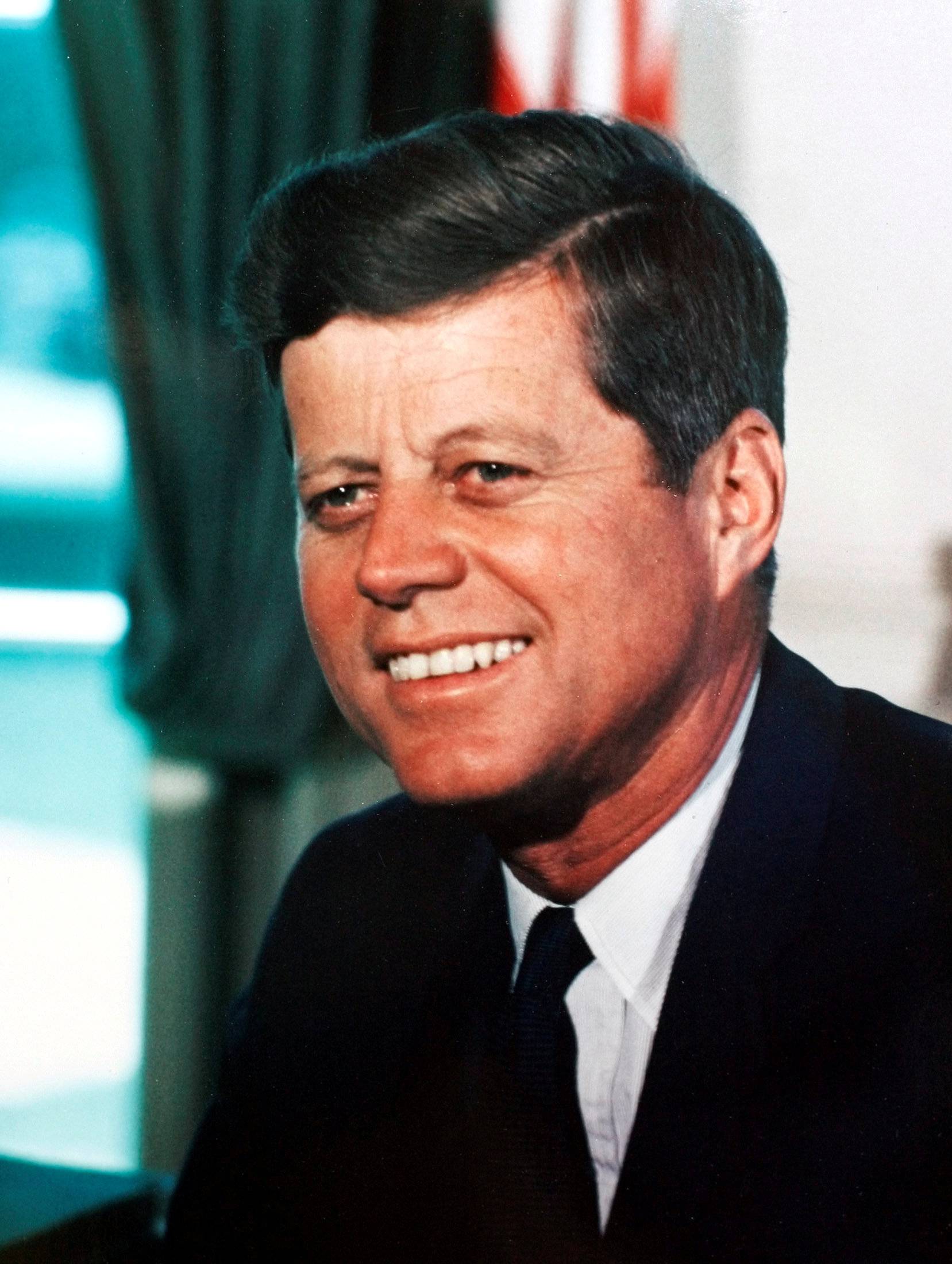 FILE PHOTO: President John F. Kennedy working in the Oval Office in the White House