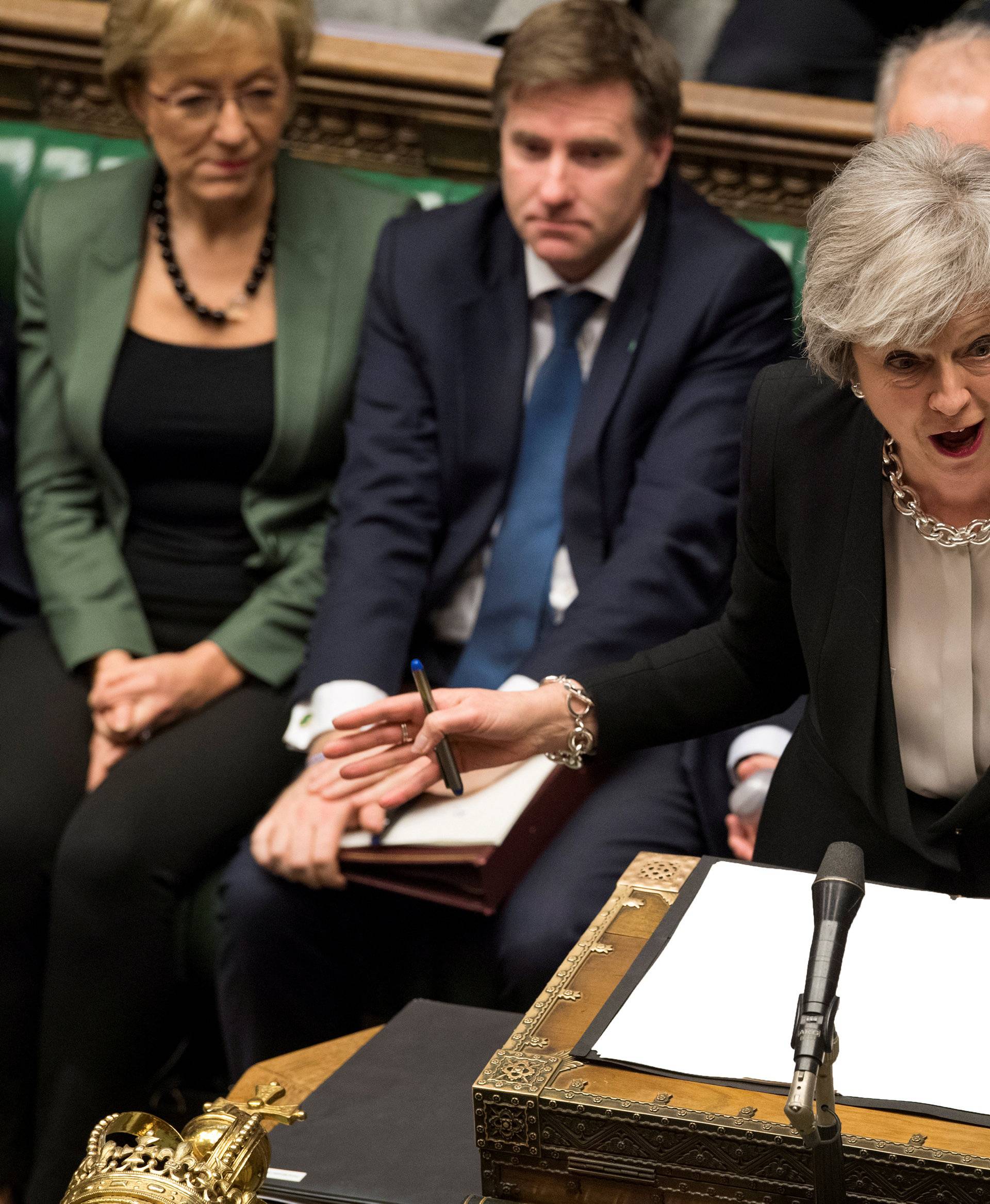 FILE PHOTO: Britain's Prime Minister Theresa May speaks during a debate on her Brexit 'plan B' in Parliament
