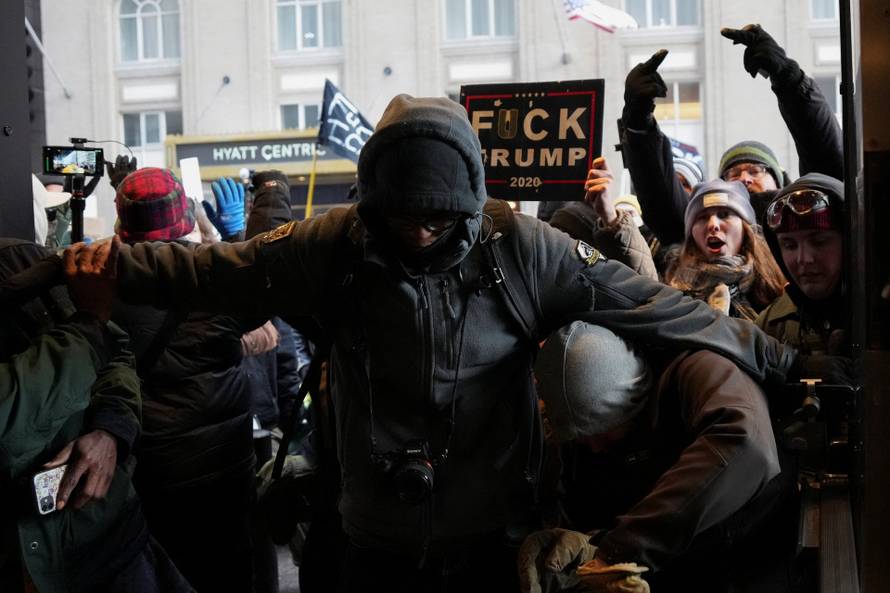 People attend the "March Against Minnesota Fraud" in Minneapolis