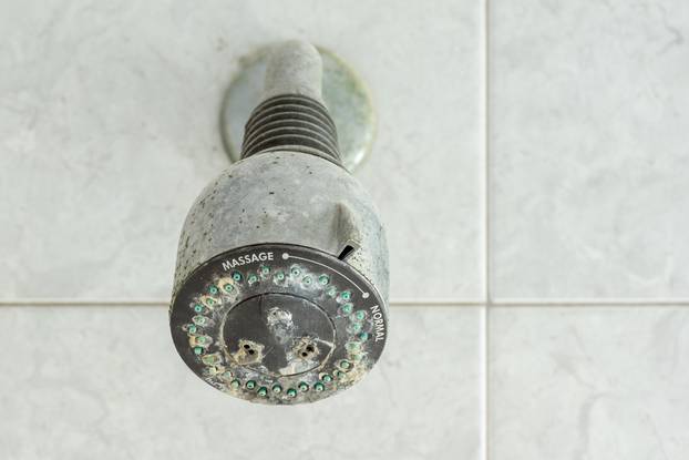 Old,Shower,Head,Clogged,With,Many,Limestone,And,Dirty,Stain