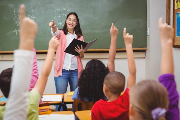 Teacher,Asking,Her,Students,A,Question,At,The,Elementary,School