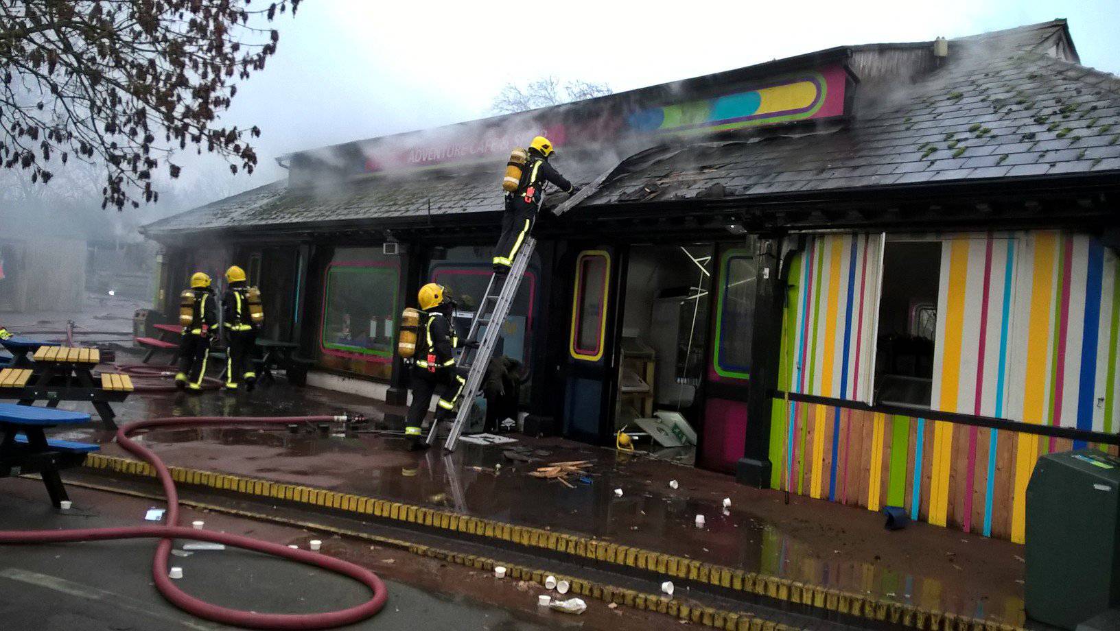 Firefighters are seen tackling a blaze at London Zoo following a fire which broke out at a shop and cafe at the attraction, in central London