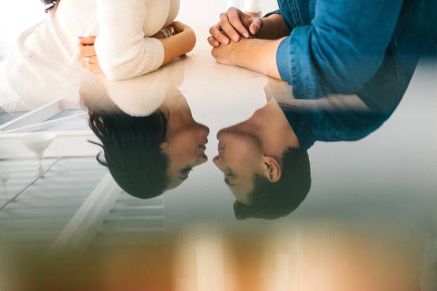Detachment of a young beautiful couple kissing. Conceptual image
