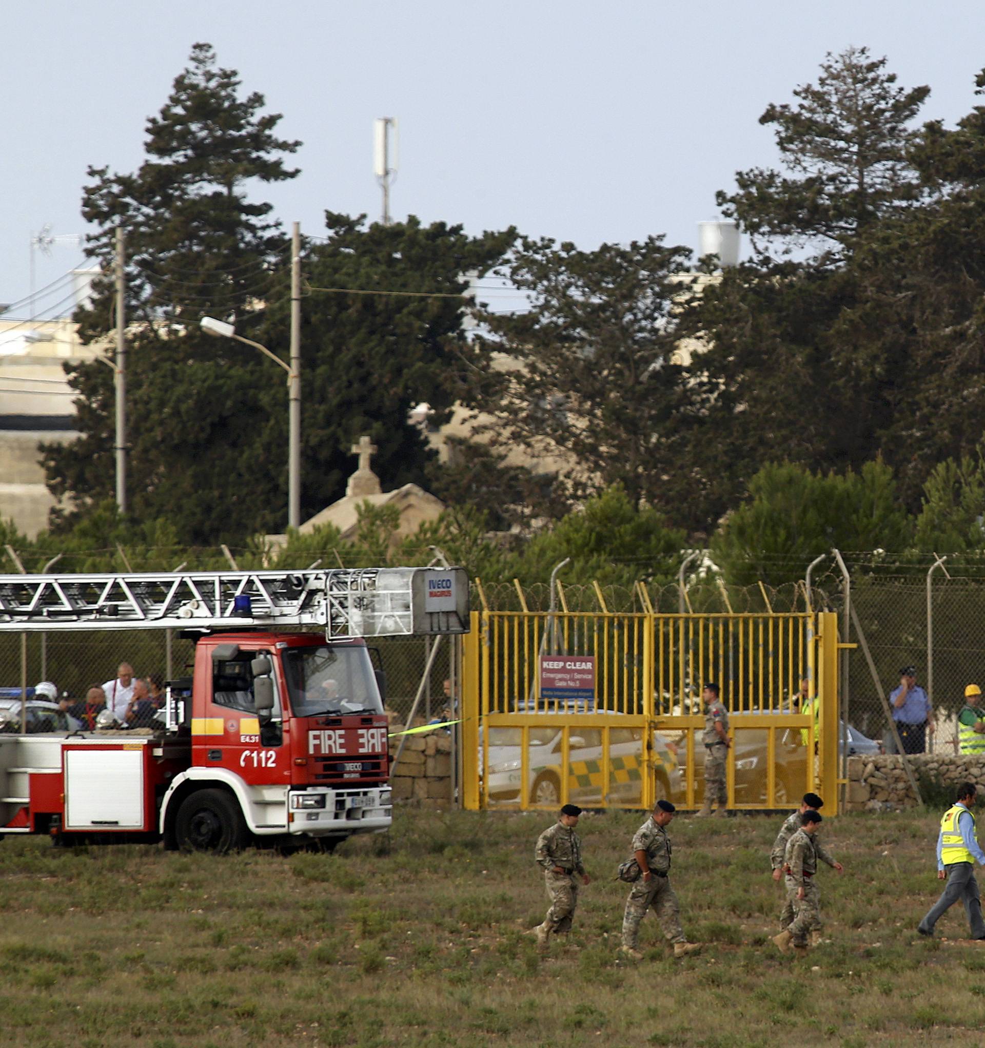 Rescue services at the scene of light aircraft crash at the airport in Malta