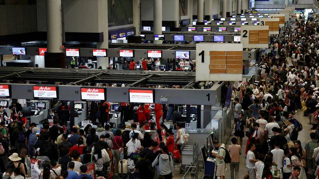 Don Mueang International Airport Terminal 1 amid system outages disrupting the airline's operations in Bangkok