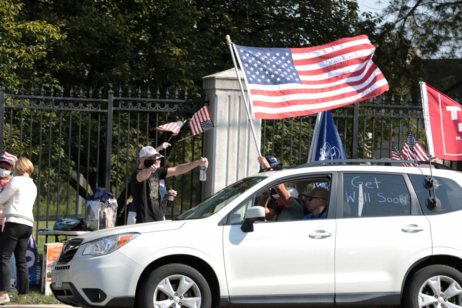 Supporters rally in support of U.S. President Donald Trump outside of the Walter Reed National Military Medical Center in Bethesda