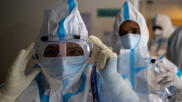 Medical workers treat patients infected with the coronavirus disease (COVID-19) at a hospital in New Delhi