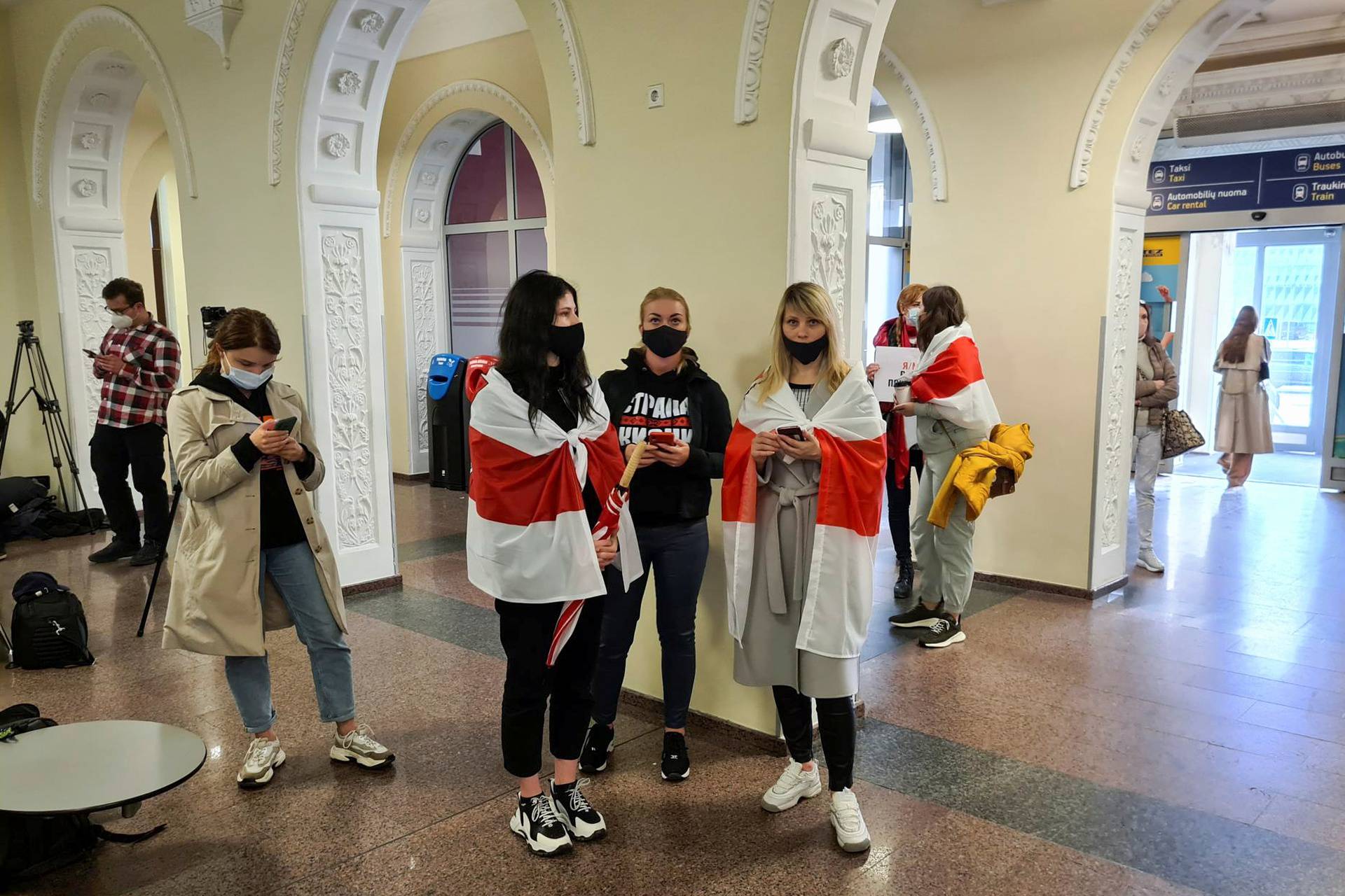 Supporters of Belarusian opposition blogger and activist Roman Protasevich wait at Vilnius Airport in Vilnius
