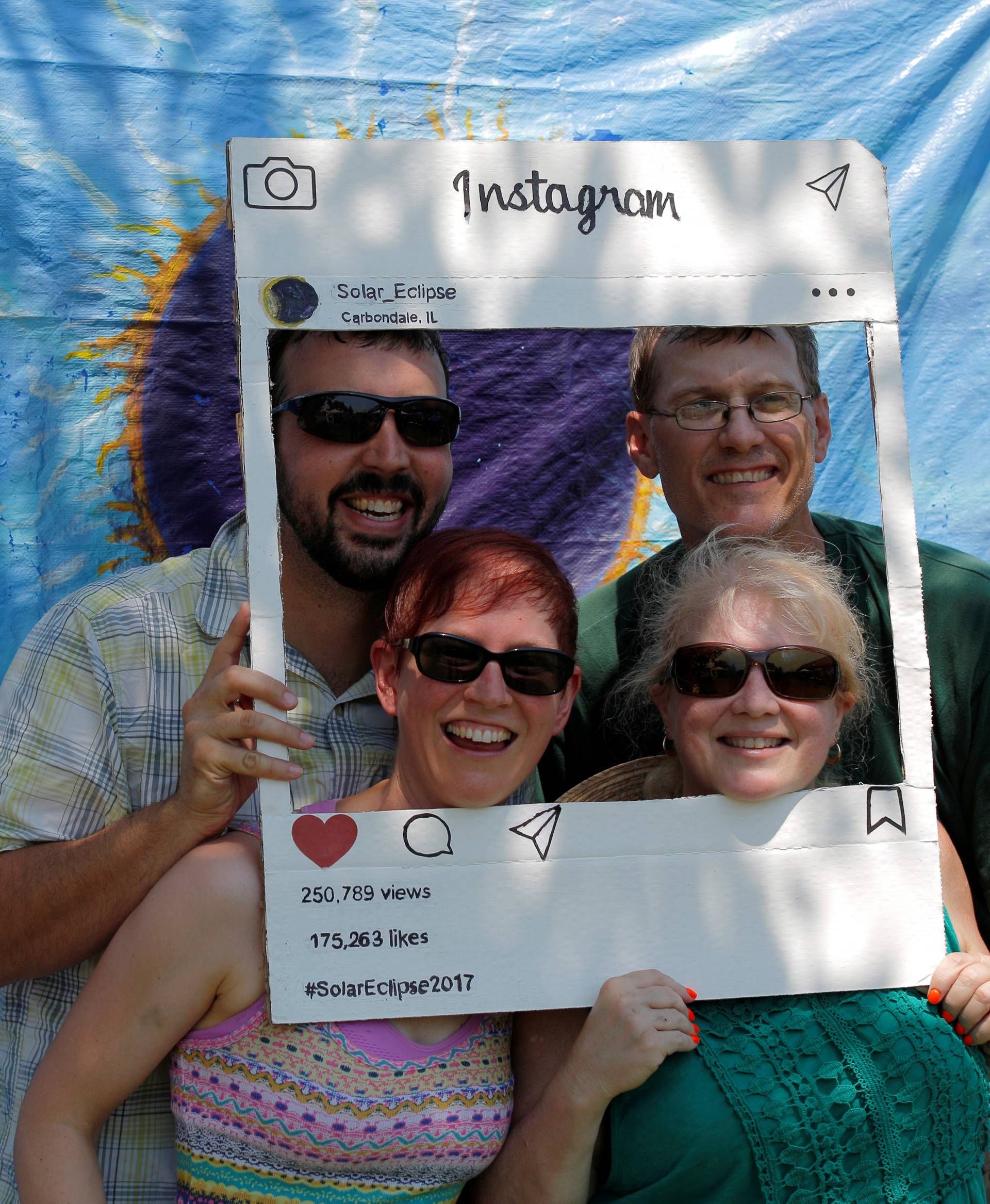 A group poses at a photo-booth in Carbondale