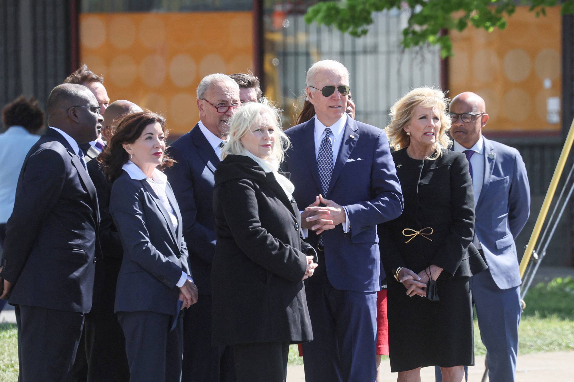 U.S. President Joe Biden and first lady Jill Biden look at a memorial in the wake of a weekend shooting at a Tops supermarket in Buffalo, New York
