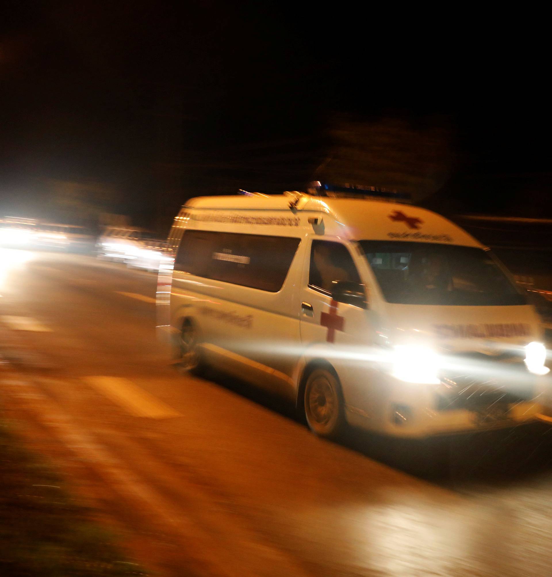 An ambulance believed to be carrying rescued schoolboys travels to a military helipad near Tham Luang cave complex in the northern province of Chiang Rai