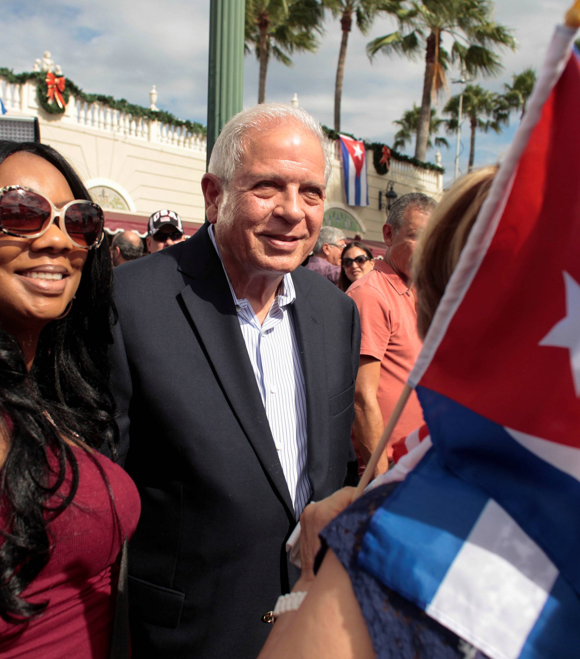 Miami Mayor Tomas Regalado gathers with people who celebrate after the announcement of the death of Cuban revolutionary leader Fidel Castro in the Little Havana district of Miami