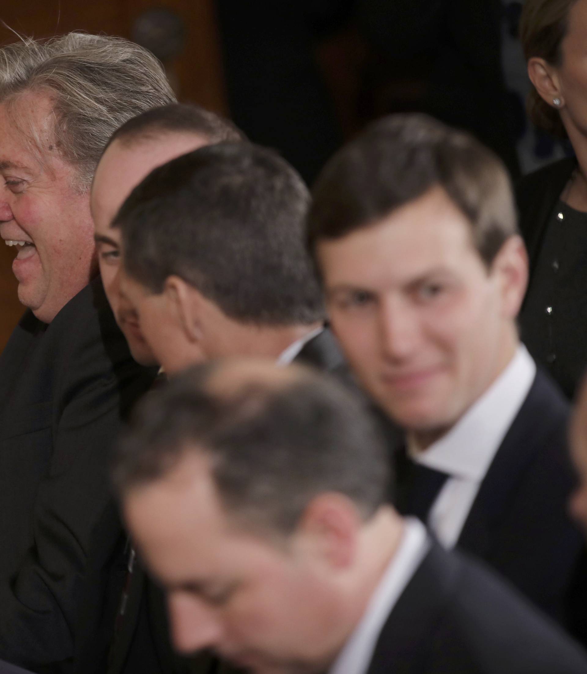 White House aides gather prior to Trudeau-Trump joint news conference at the White House in Washington