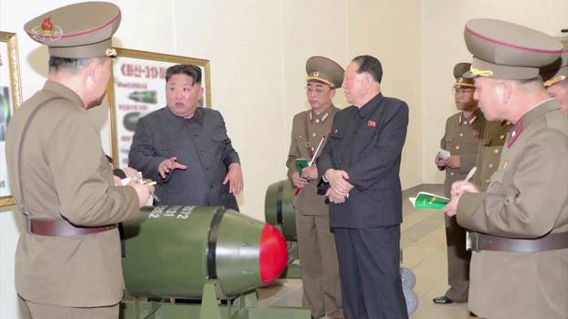 North Korean leader Kim Jong Un inspects nuclear warheads at an undisclosed location