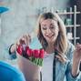 Close-up portrait of nice attractive lovely pretty cheerful cheery wavy-haired girl getting receiving congrats card birthday greetings red flowers at modern industrial loft brick style interior room