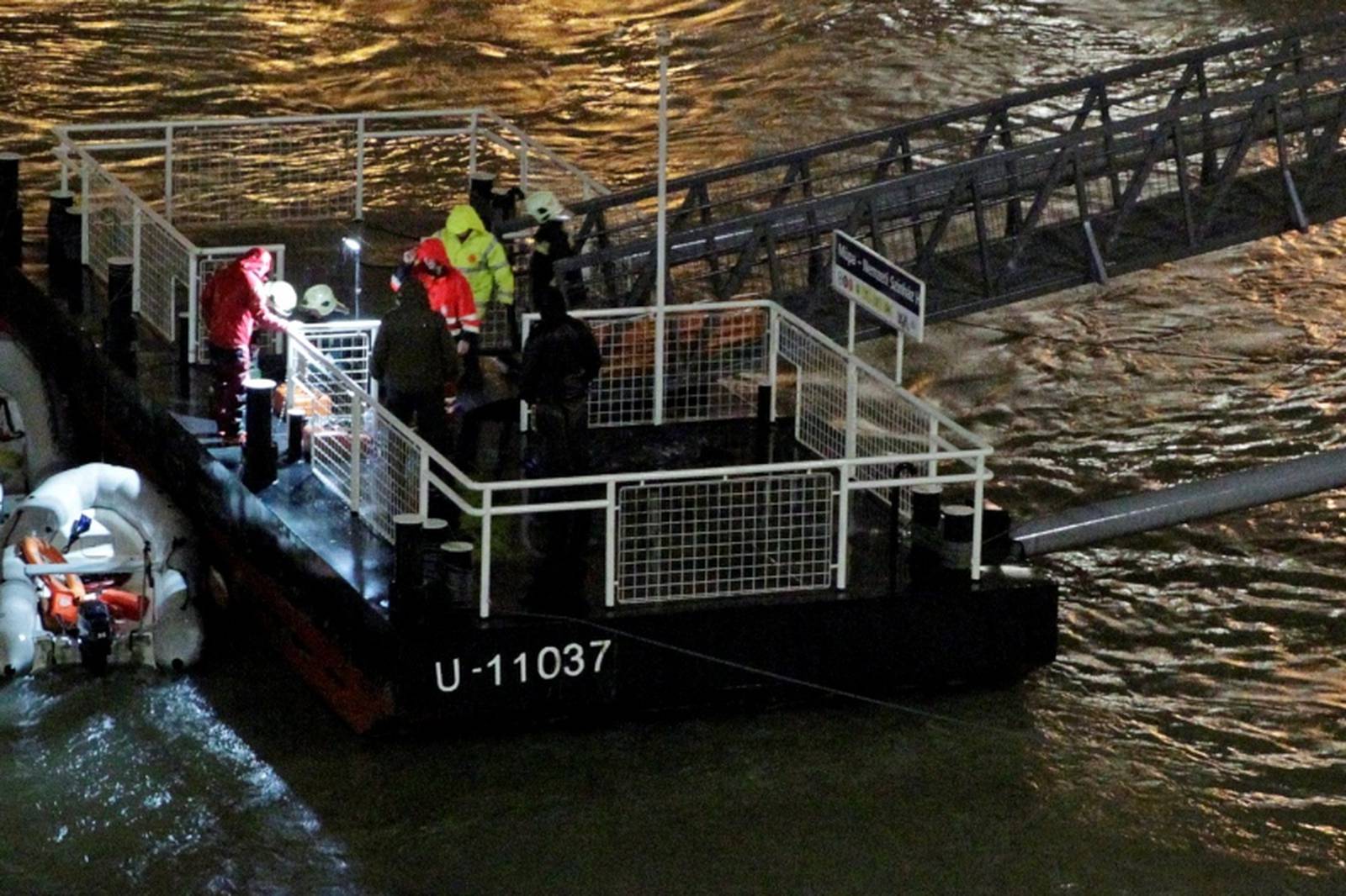 A rescue boat is seen on the Danube river after a tourist boat capsized in Budapest