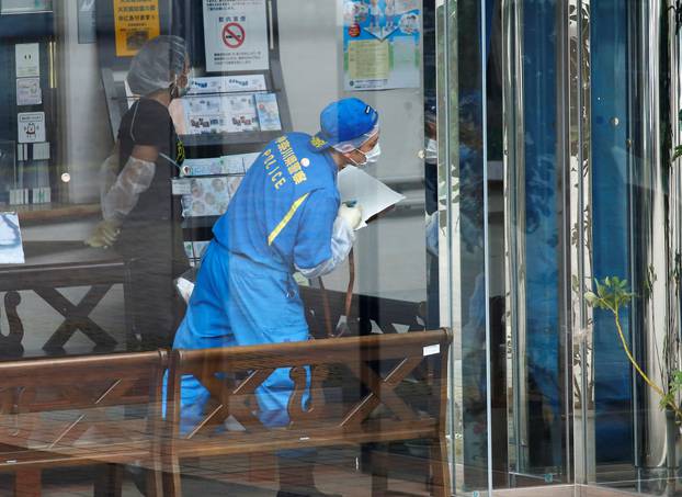 Police officers investigate at a facility for the disabled, where a deadly attack by a knife-wielding man took place, in Sagamihara, Kanagawa prefecture, Japan