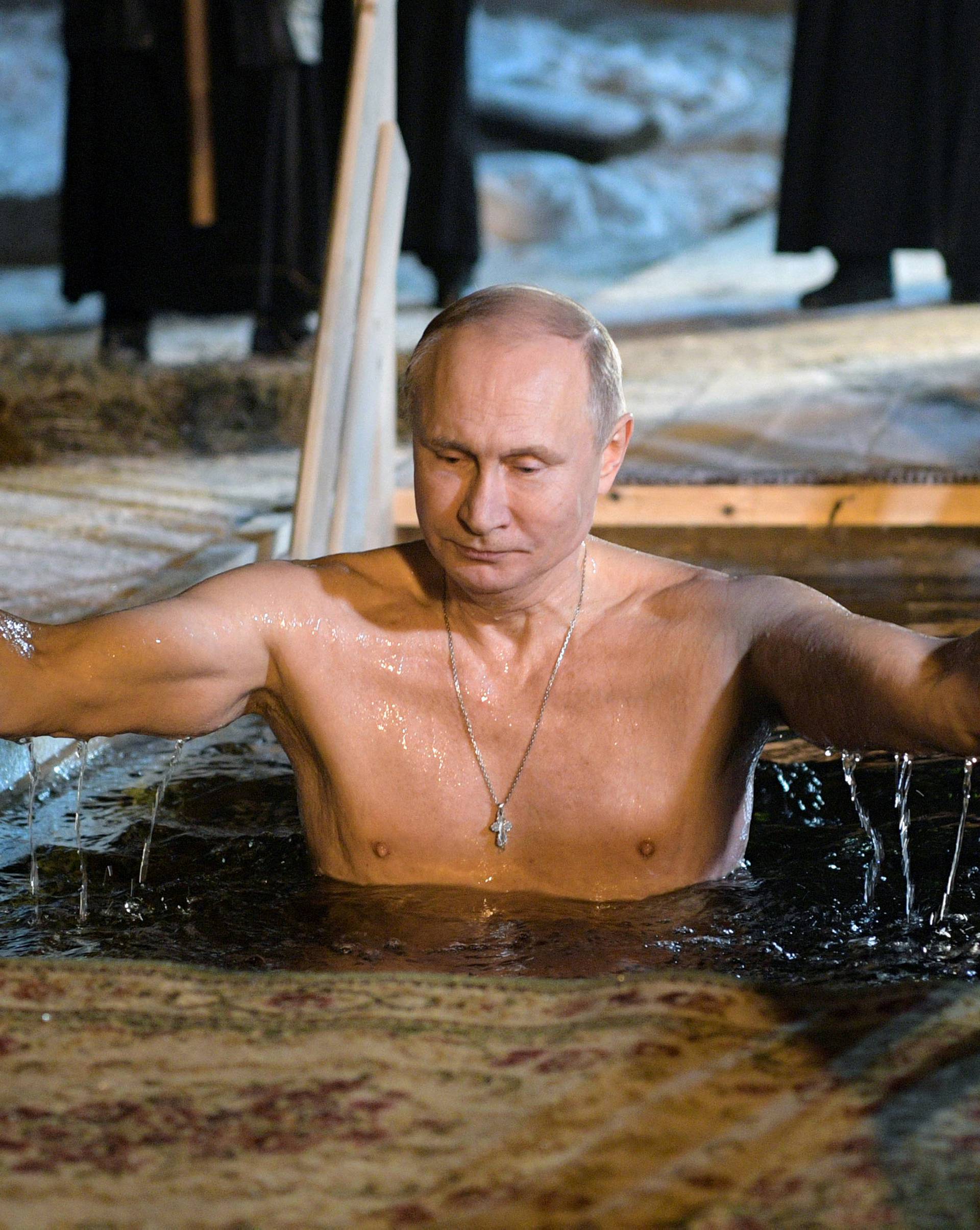 Russian President Vladimir Putin takes a dip in the water during Orthodox Epiphany celebrations at lake Seliger, Tver region