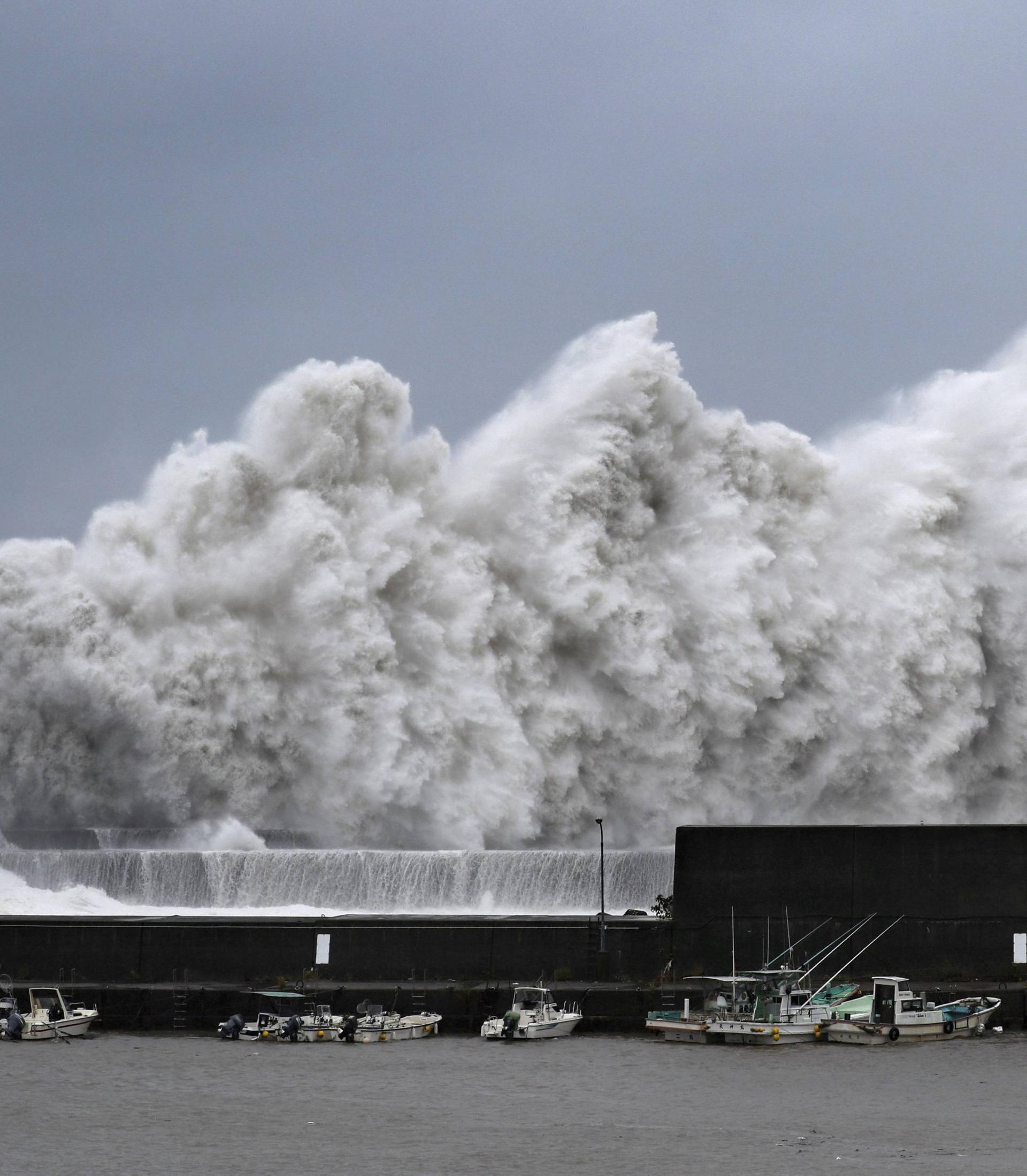 High waves triggered by Typhoon Jebi are seen at a fishing port in Aki