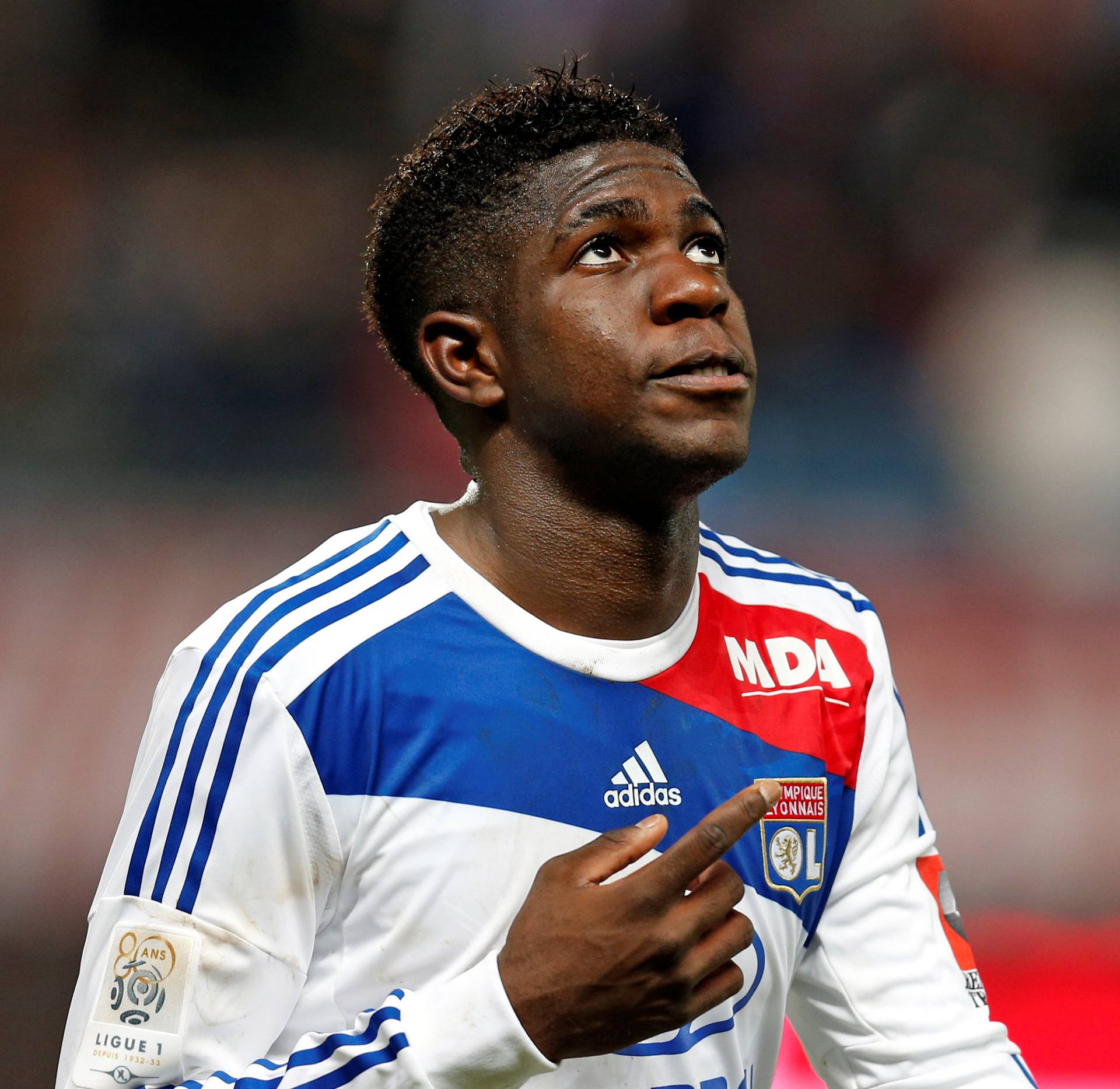 Olympique Lyon's Umtiti celebrates after scoring a goal against Troyes during their French Ligue 1 soccer match at the Stade de l'Aube stadium in Troyes
