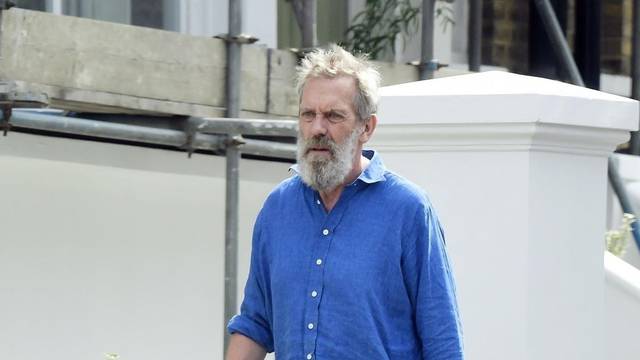 *EXCLUSIVE* STRICTLY NOT AVAILABLE FOR ONLINE USAGE UNTIL 22:00 PM UK TIME ON 02/08/2022 - WEB MUST CALL FOR PRICING  - The English Actor Hugh Laurie cuts a rather dishevelled look during his jaunt out walking the dog in North London.*PICTURES TAEKN ON