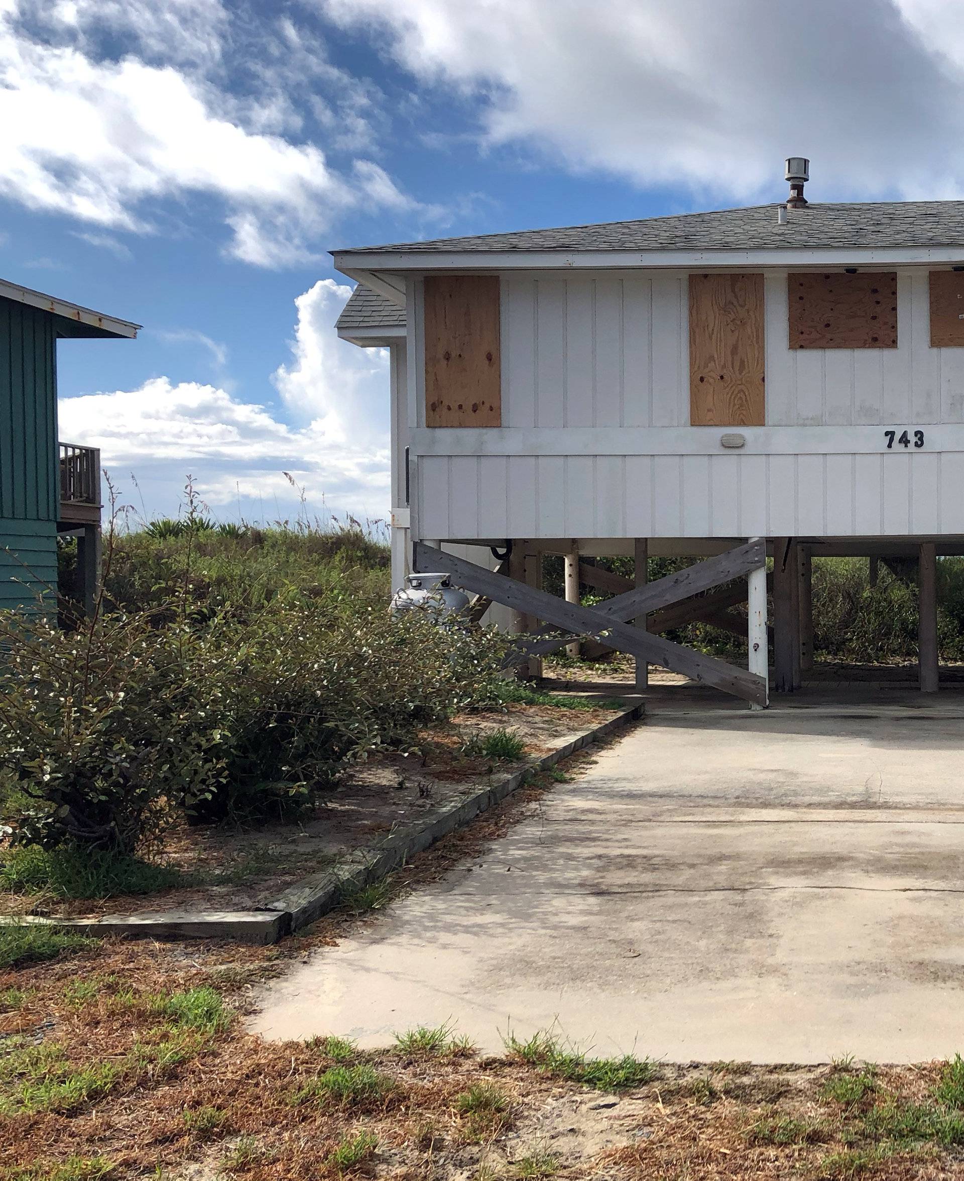 A beachfront home is boarded up ahead of Hurricane Florence, at Holden Beach