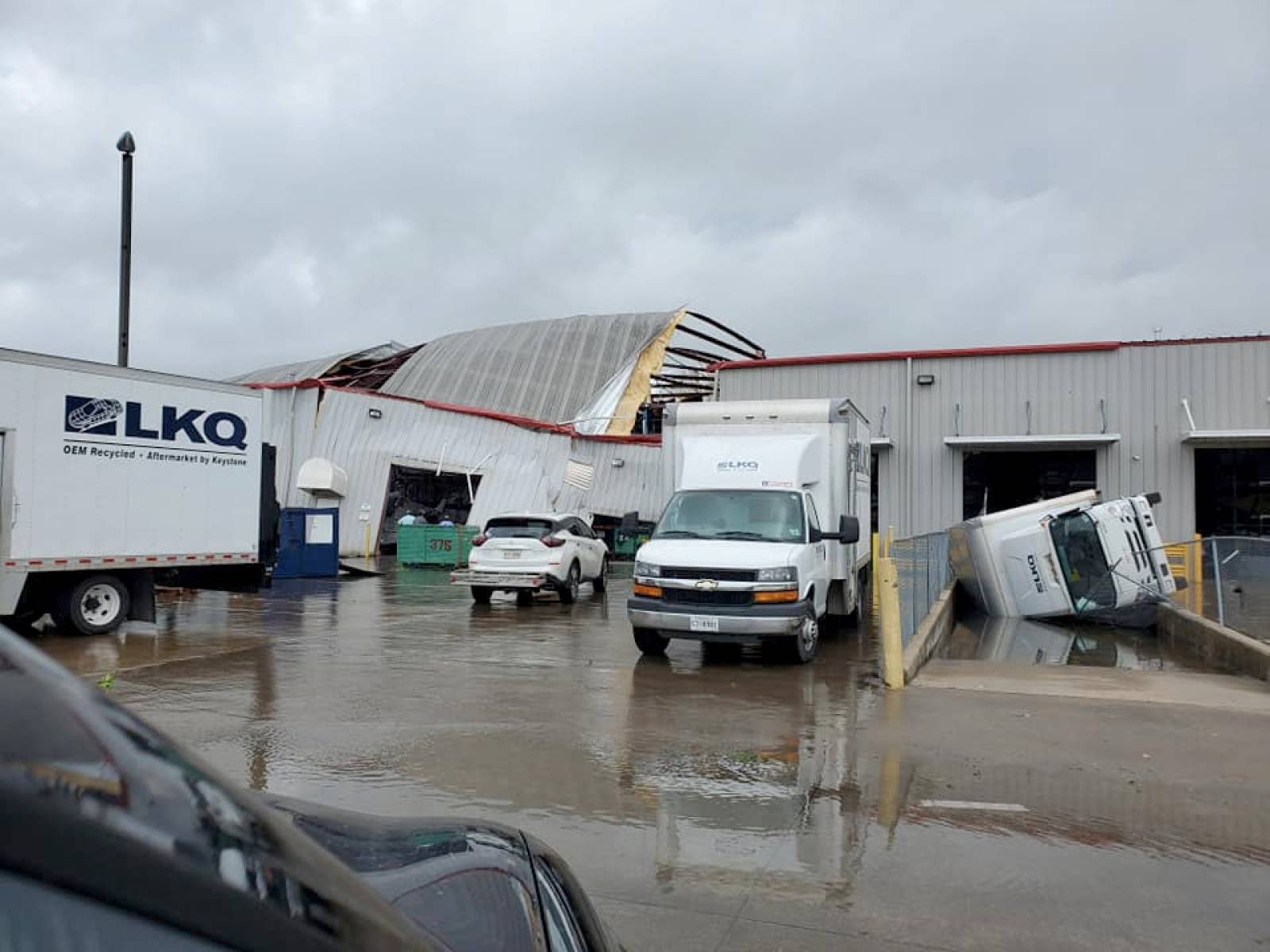 Social media images of damaged buildings and vehicles in the aftermath of a tornado in Monroe, Louisiana