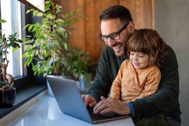 Young,Handsome,Man,Works,From,Home,At,Laptop,,While,His