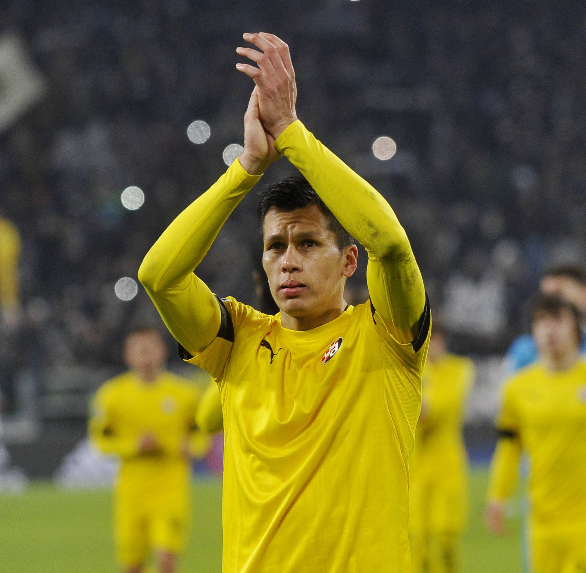 Dinamo Zagreb's Leonardo Sigali applauds fans after the game