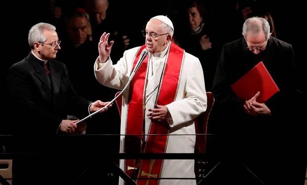 Pope Francis leads the Via Crucis (Way of the Cross) procession during Good Friday celebrations at the Colosseum in Rome