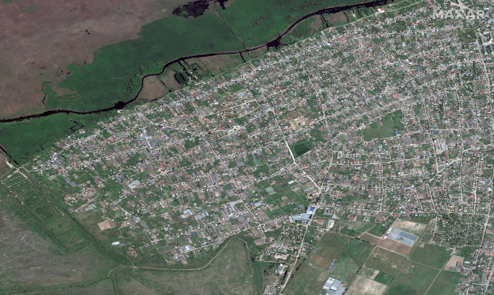 A satellite image shows the town of Oleshky