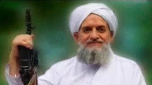 FILE PHOTO: A photo of Al Qaeda leader Ayman al-Zawahiri is seen in this still image taken from a video