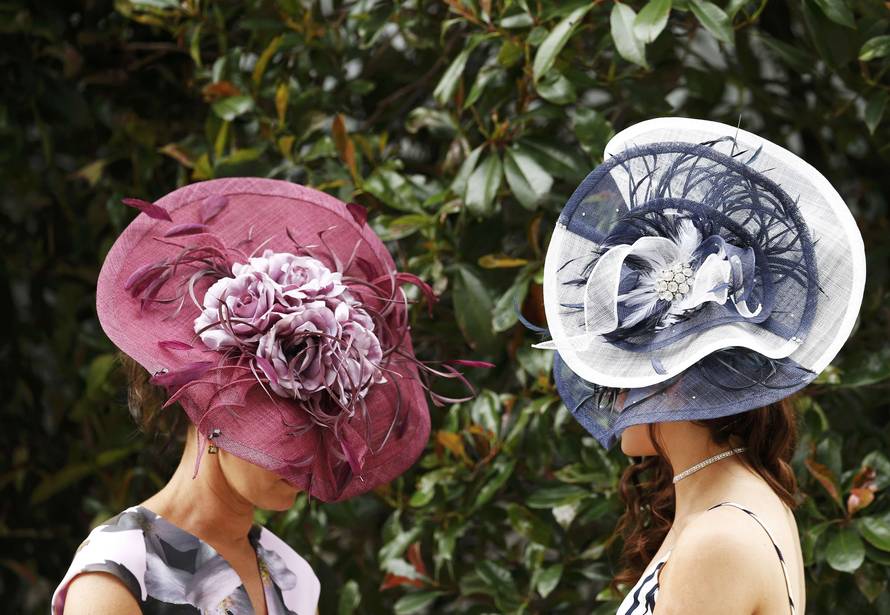 Britain Horse Racing Ladies Day Racegoer wears hat